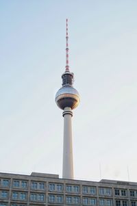 Low angle view of communications tower against sky