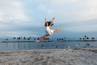 Full length of woman jumping in mid-air