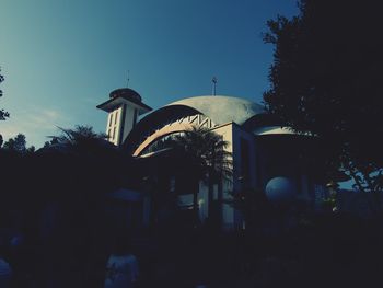 Low angle view of building against clear blue sky