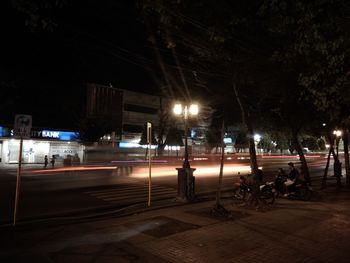 Cars on road in city at night