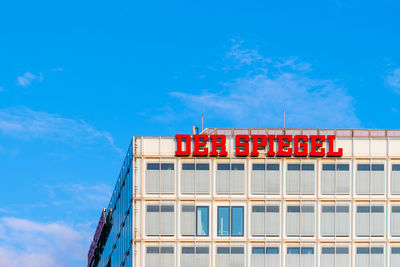 Low angle view of red building against sky