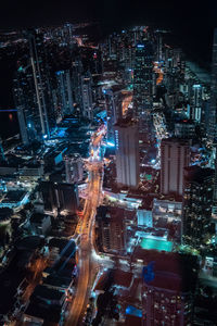 High angle view of illuminated city buildings at night