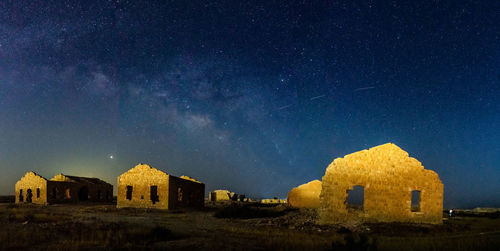 Old building against sky at night