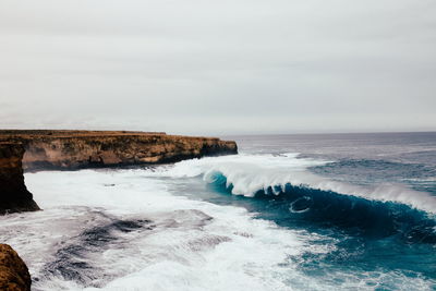 Waves splashing on rocks