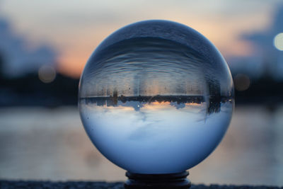 Reflection of crystal ball on glass