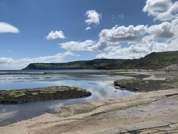 Scenic view of beach against sky