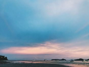 Scenic view of beach against sky during sunset