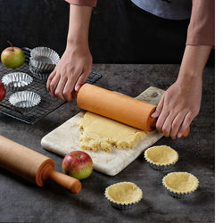 Midsection of woman preparing food at home