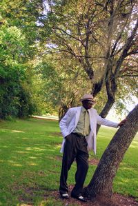 Full length of man standing by tree in park