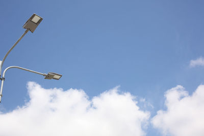 Low angle view of street light against sky