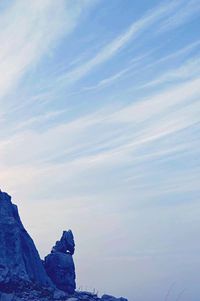 Low angle view of mountain against blue sky