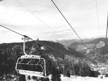 Overhead cable car against sky