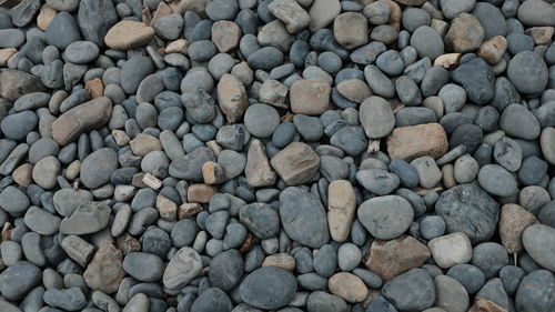 High angle view of stones on pebbles