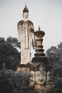 Low angle view of statue against building