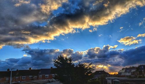 Low angle view of buildings against sky during sunset