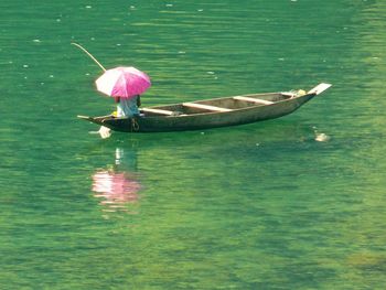 Woman in boat on lake