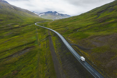 High angle view of road amidst landscape against sky