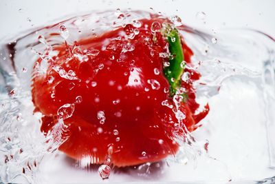 Close-up of water splashing in glass