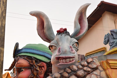 Low angle view of statue against sky