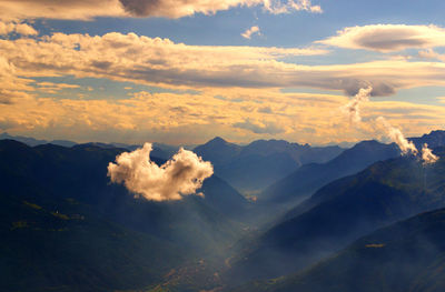 Scenic view of mountains against dramatic sky