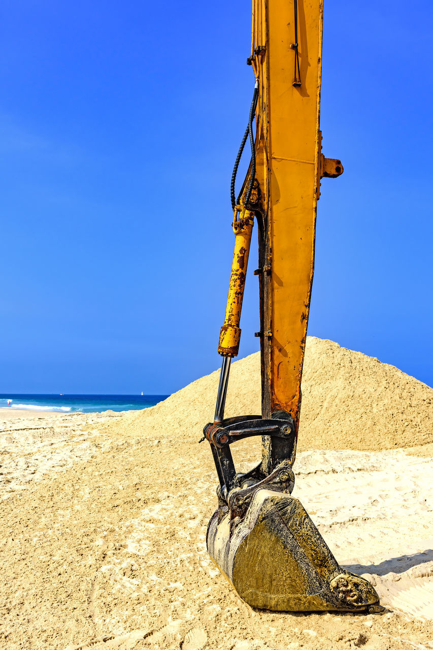 sky, land, sunlight, beach, nature, sand, sea, blue, day, metal, clear sky, horizon, water, no people, outdoors, machinery, horizon over water, scenics - nature, tranquility