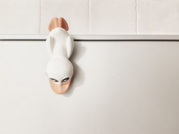 Close-up of stuffed toy against white wall