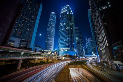 High angle view of light trails on road at night