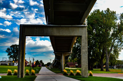 Empty road with buildings in background