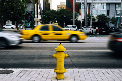 Yellow car on city street