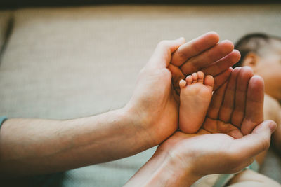 Close-up of couple holding hands