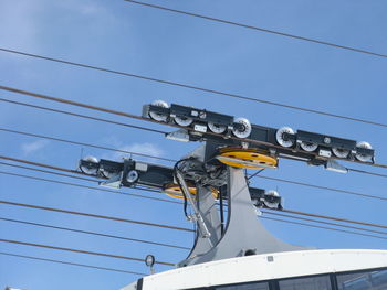 Low angle view of telephone pole against sky