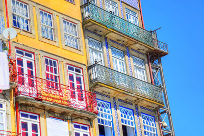 Low angle view of building against clear blue sky