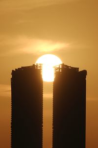 Low angle view of building against sky during sunset