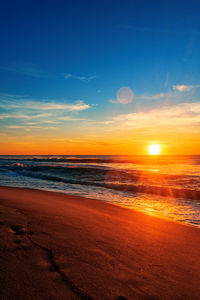 Scenic view of sea against sky during sunrise