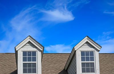 Low angle view of building against blue sky