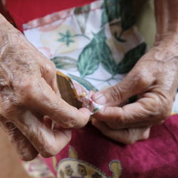 Cropped image of woman sewing textile