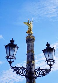 Low angle view of statue of street light