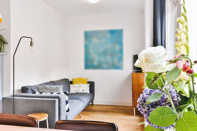 Flower vase on table at home