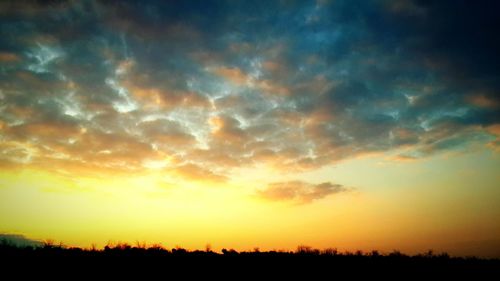 Scenic view of silhouette landscape against sky during sunset