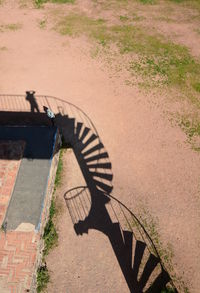 High angle view of person walking on footpath