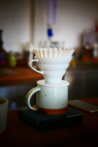 Close-up of coffee cup on table