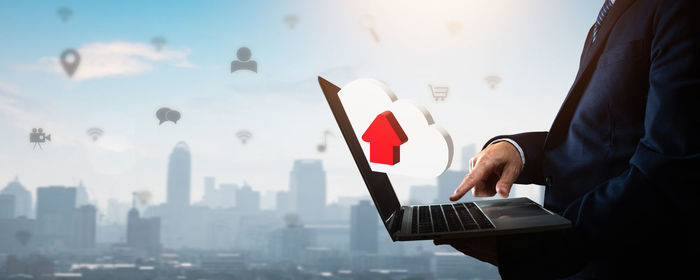 Midsection of woman using mobile phone