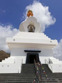 Low angle view of statue against building