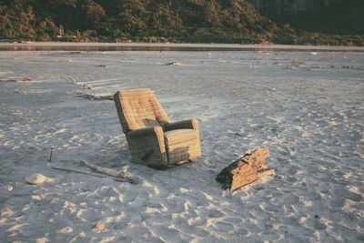 Empty reclining chair on beach