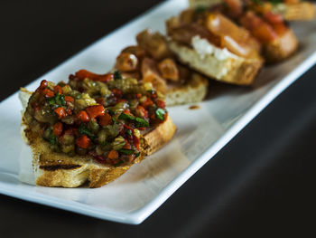 Bruschettas served in tray on table