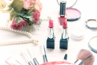 High angle view of pink flower on table