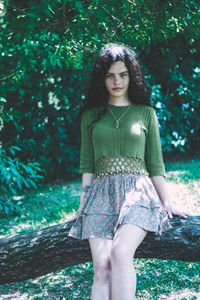 Portrait of young woman in forest