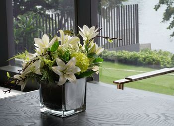 Close-up of white flower vase on table