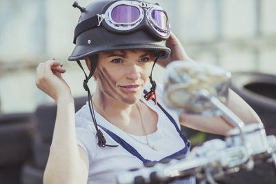 Portrait of young woman riding motorcycle