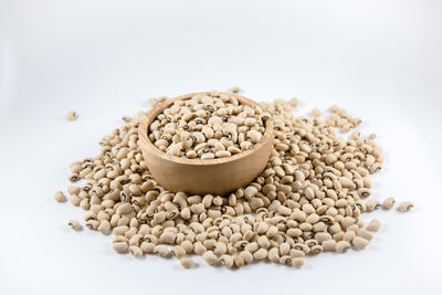 Close-up of coffee beans against white background